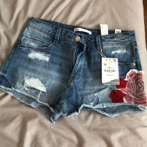 Embroidered and distressed never worn Jean shorts